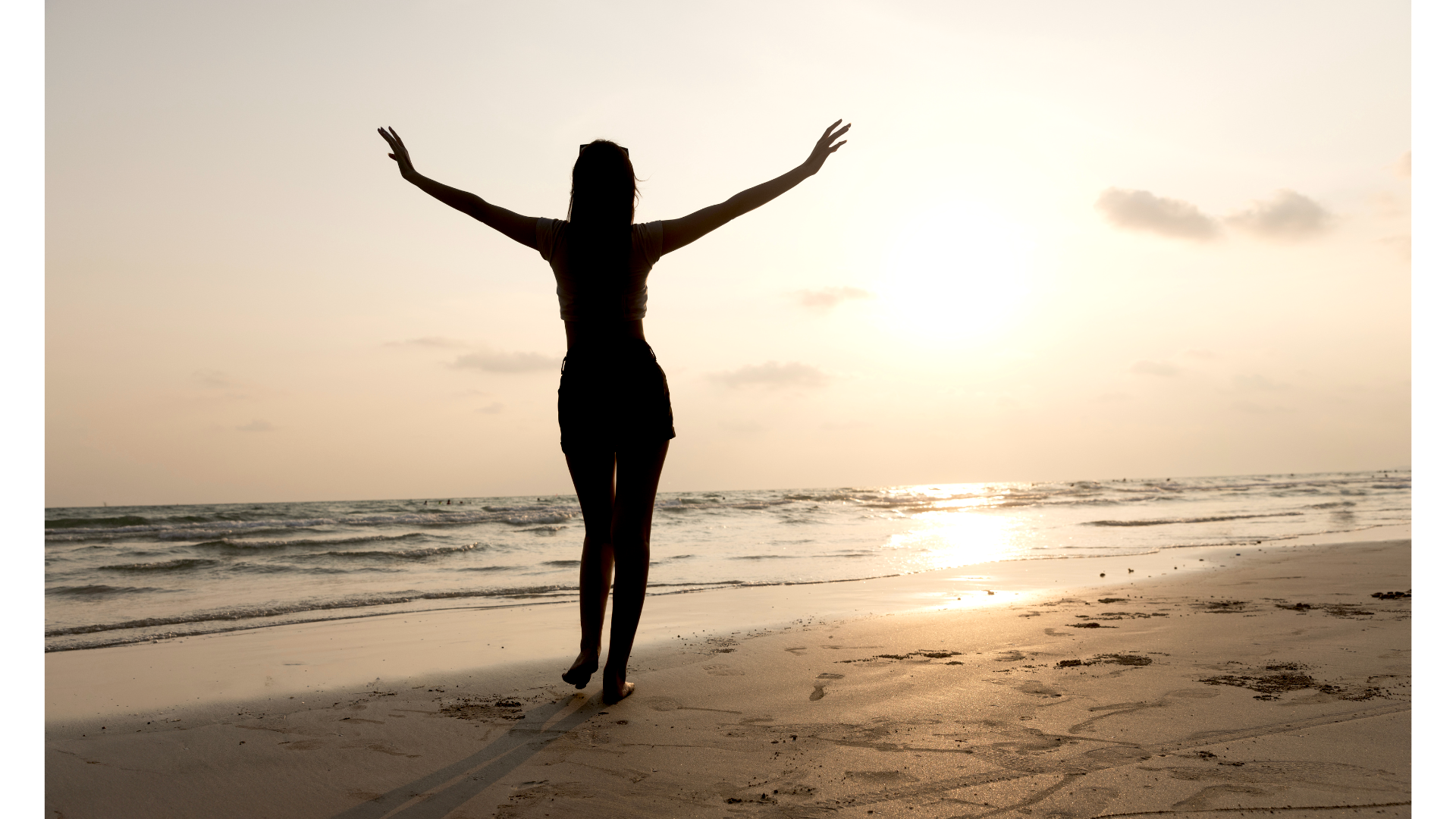 Silhouette of a woman on a beach dancing while contemplating the weekly horoscope for August 3-9, 2025